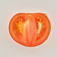 Cutted ripe tomato on the white paper background. - 480367089