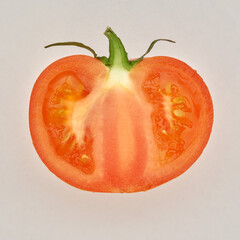 Cutted ripe tomato on the white paper background. - 480367093