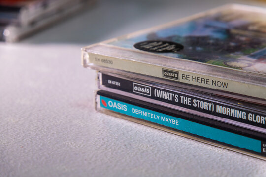 Kumamoto, JAPAN - Sep 1 2021 : Conceptual First 3 albums (Definitely Maybe, (What's the Story) Morning Glory? and Be Here Now) released in 1990&rsquo;s by UK brit-pop rock band Oasis on the table.