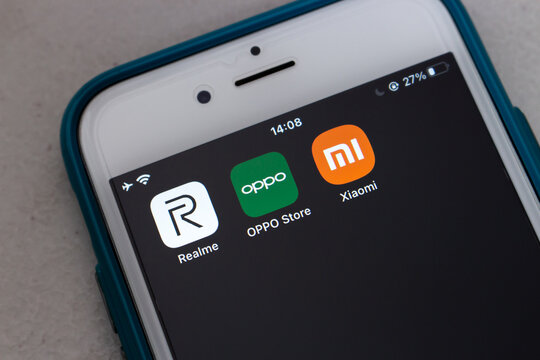 Kumamoto, JAPAN - Nov 23 2021 : Popular Chinese smartphone brand Realme (Subsidiary of BBK Electronics), Oppo (Guangdong Oppo Mobile Telecommunications Corp., Ltd) and Xiaomi icons on smartphone.
