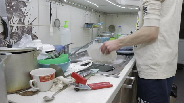 dirty dishes in the kitchen,cleaning and washing dishes after a party, timelapse