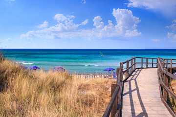 The Regional Natural Park Dune Costiere (Torre Canne): wooden walkway between sea dunes. in Apulia, Italy. The park covers the territories of Ostuni and Fasano along eight kilometres of coastline.