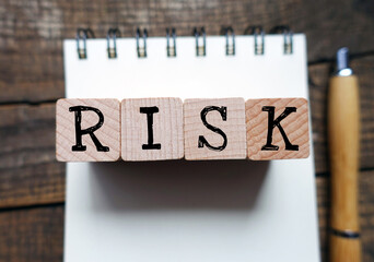 RISK word composed of wooden blocks.