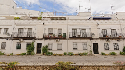 Tradtional houses along a cobblestone street in Cordoba, Spain