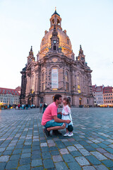 person standing in front of a church