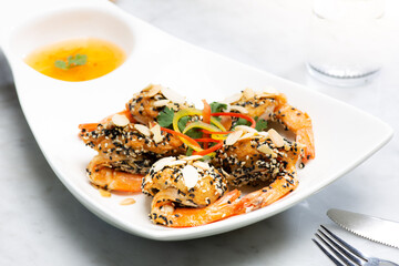 Shrimps in sweet and sour sauce.Breaded shrimp with sesame seeds.soft focus.shallow focus effect.