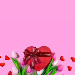 Red gift box in the form of a heart on a pink background. Valentine's Day. banner with space for text