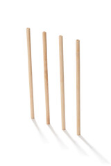 Detailed shot of reusable bamboo straws. The straws are made of light natural wood. The set of eco-friendly cocktail straws is located on the white background.