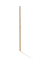 Detailed shot of a reusable bamboo straw. The straw is made of light natural wood. The eco-friendly cocktail straw is located on the white background.