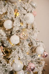 Snowy vintage christmas tree decorations with white baubles ornaments