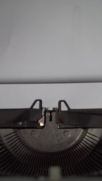 Written DARWIN DAY on a white paper with vintage typewriter