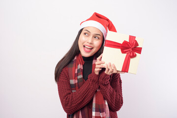 Portrait of young smiling woman wearing red Santa Claus hat isolated white background studio.