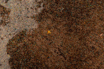 Coral transparent slime with bubbles inside on black background. Kids toy slime.