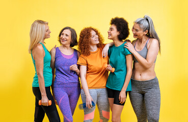 Group of different kind of women with different body, age, and ethnicity making sport