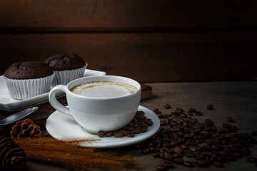 Chocolate cake and a cup of coffee served in the morning.