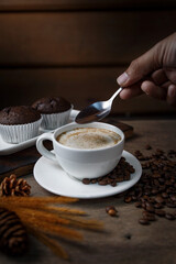 Chocolate cake and a cup of coffee served in the morning.