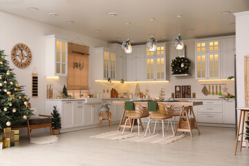 Cozy open plan kitchen decorated for Christmas. Interior design