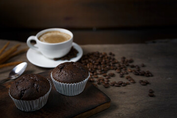 Chocolate cake and a cup of coffee served in the morning.