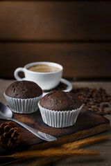 Chocolate cake and a cup of coffee served in the morning.