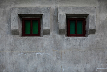 Fototapeta na wymiar old stone building with small windows