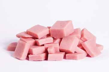 Fresh ham cubes stack isolated on white background