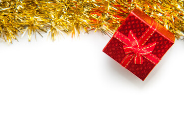 Red gift box with golden ribbon on white background