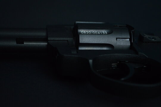 a flobert revolver on the black background