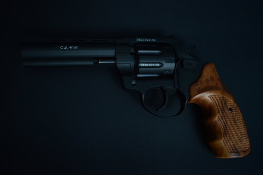 a flobert revolver on the black background