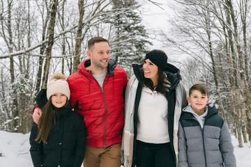 Portrait of a four Family On forest Winter season