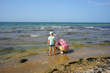 dad and son on the beach