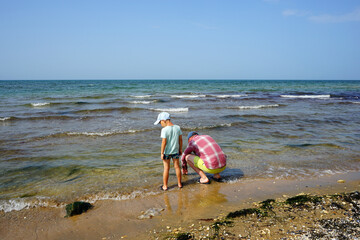 dad and son on the beach