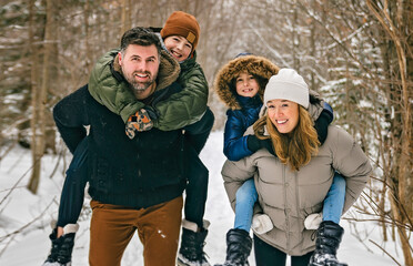 Portrait of a four Family On forest Winter season