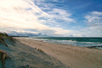 View over the dunes to the Baltic Sea at sunset.