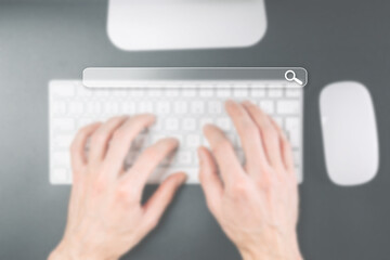 Searching online. Internet web search engine selective focus. Blured fingers touching computer for...