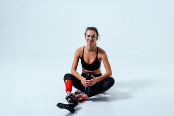Amputated woman. Cinematic image of a beautiful young woman with leg prosthesis.