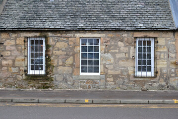 Three Identical Windows in Old Traditional Roadside Stone Cottage 