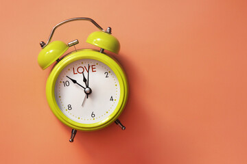 Alarm clock with the inscription: love. Find time for Love