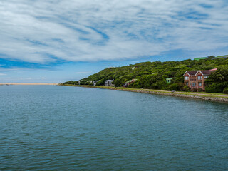 Fototapeta na wymiar kleinemonde beach front and houses on the river bank in Port Alfred South Africa