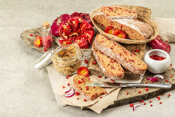 Fresh homemade chicken liver pate or paste in a glass jar with baguette slices on the serving board