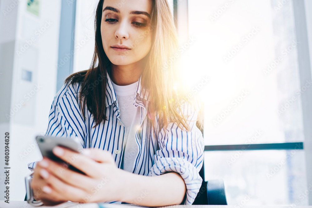 Aufkleber youthful caucasian blogger checking smartphone notification for installing application, millennial g