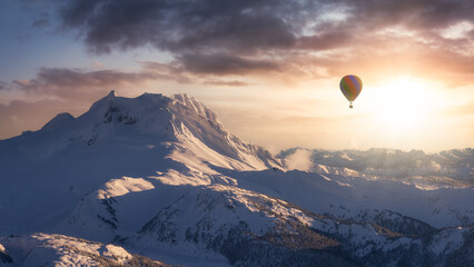 Fototapeta Dramatic Mountain Landscape covered in clouds and Hot Air Balloon Flying. 3d Rendering Adventure Dream Concept Artwork. Aerial Image from British Columbia, Canada. Sunset or Sunrise Sky obraz