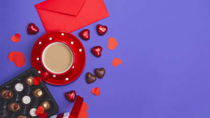 Box of tasty chocolates and ribbon for Valentine's Day on violet background.