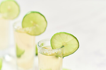 Close up of shots of traditional tequila. Mexican alcoholic drink.