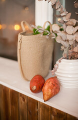 sweet potato on the kitchen counter and eco jute bag with groceries after shopping for food