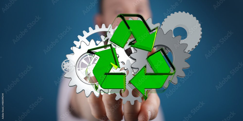 Poster above some gears and close up on three small green gears