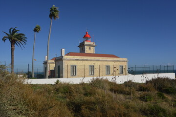 Lighthouse at the coast in the Algarve, Portugal