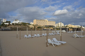 lounge chairs on the beach in the algarve, portugal