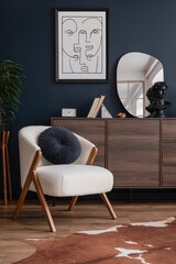 Stylish compositon of elegant living room interior design with fluffy armchair, wooden commode,...