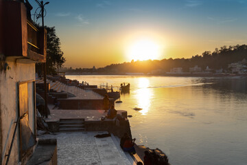 Sunset near Ram jhula bridge of Rishikesh, famous for association with Hindu mythology God Ram,...