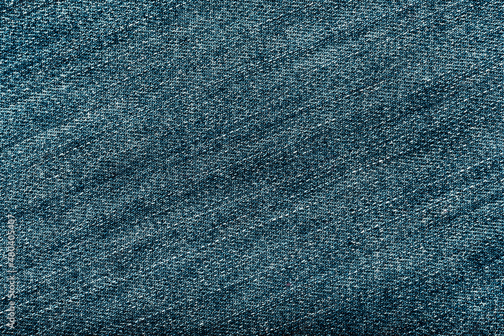 Wall mural Blue denim background. Jeans texture closeup. Clothes